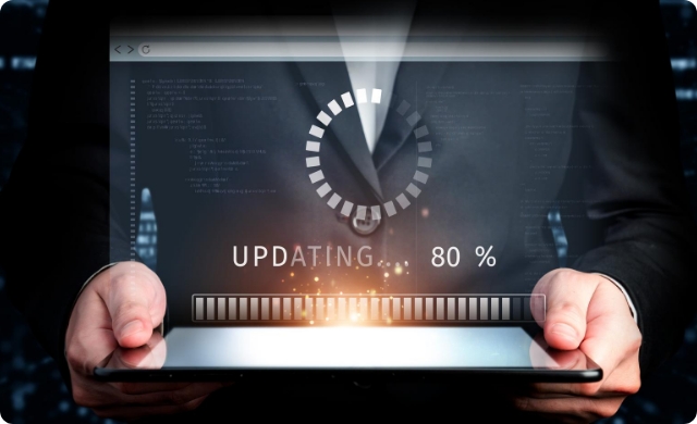 Business professional holding a tablet displaying software update progress at 80%—illustrating real-time AI system upgrades and continuous optimization in medical coding technology.