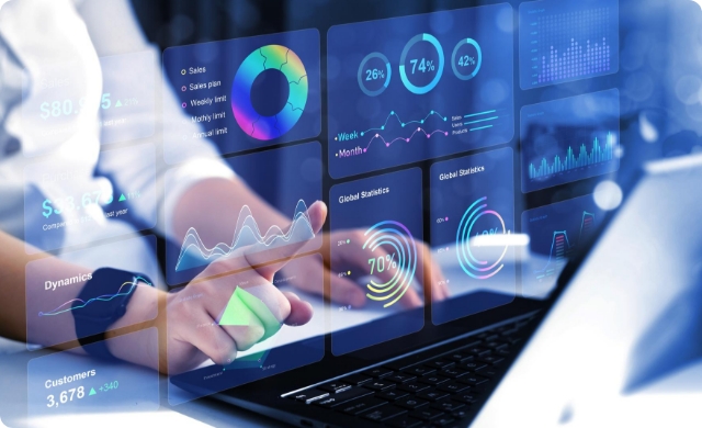 Close-up of hands interacting with futuristic data analytics dashboard on a laptop—featuring performance graphs, KPIs, and AI metrics for intelligent medical coding insights.