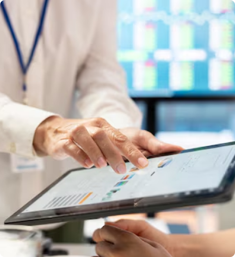 Doctor analyzing patient health analytics on a digital tablet—representing AI-powered preventive health checkups, real-time medical data, and early disease detection.